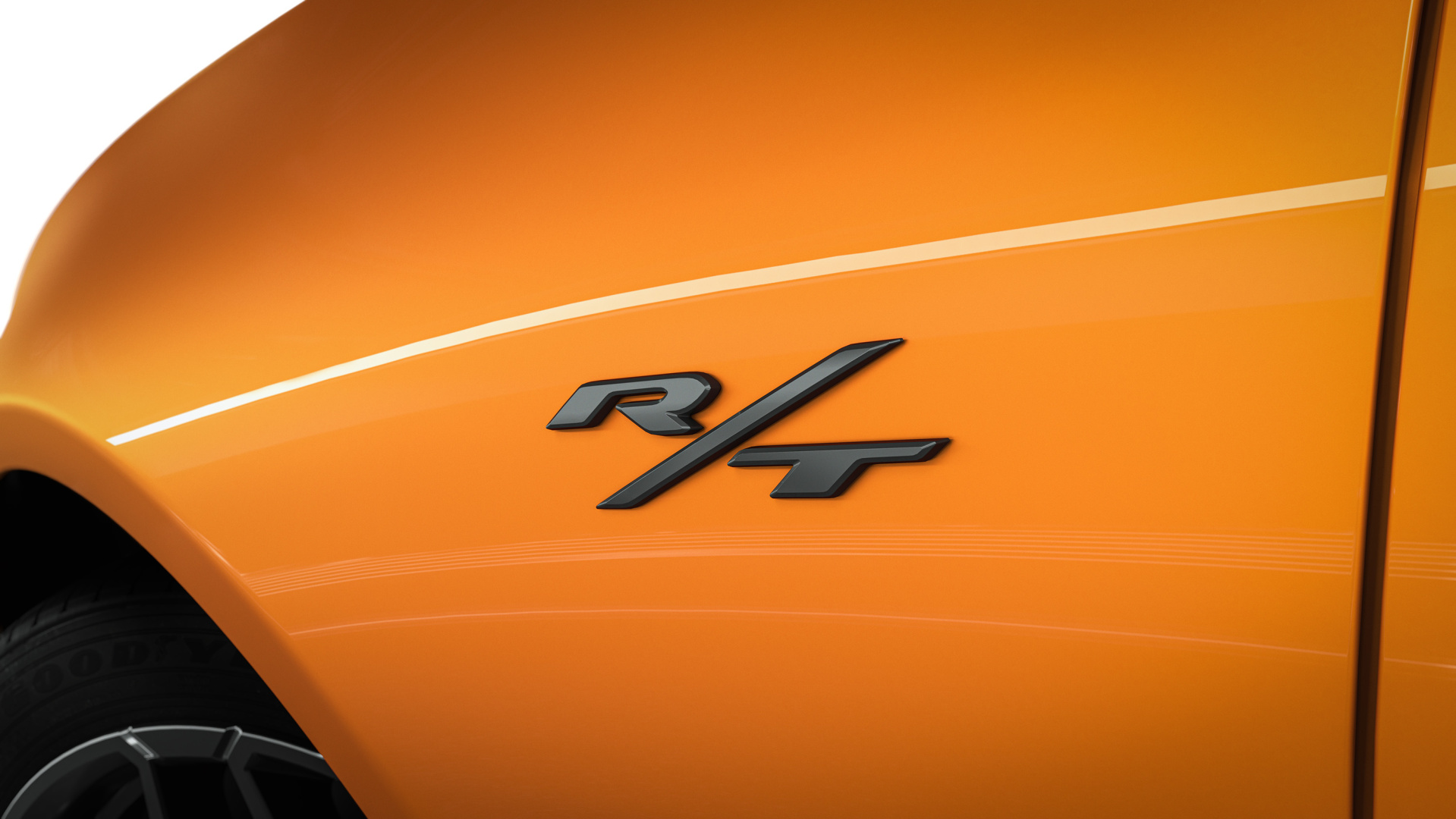 SMALL_UniquefenderbadgingidentifiesboththeDodgeChargerDaytonaScatPackandChargerRTshownheremodels.